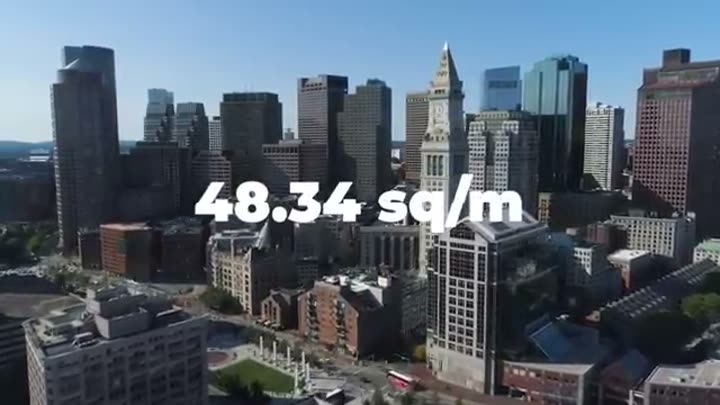 Boston skyline with data overlay, highlighting the high cost of urban living.